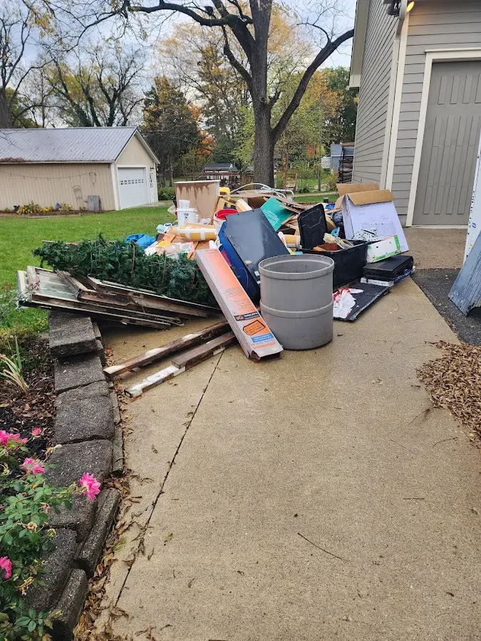 Dumpster being loaded with debris for 10 Yard Dumpster Rental in Andalusia